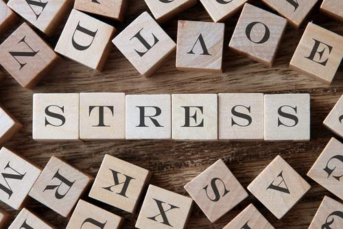 Cheesy-Stock-Photo-of-Stress-Written-in-Blocks